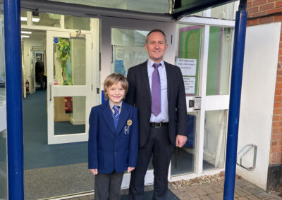 A JD pupil stands with Mr Gower.