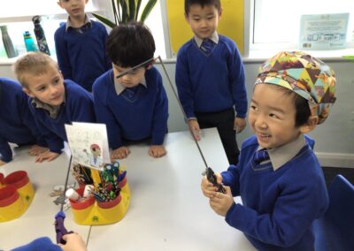 Year 1 trip picking up pencils with a a surgical instrument.