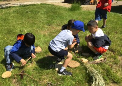 Year 1 pupils look at wood on their school trip.